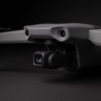 a close up of a camera attached to a skateboard