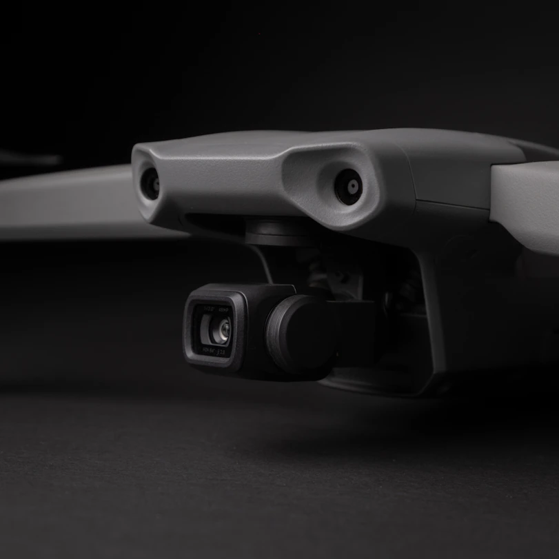 a close up of a camera attached to a skateboard