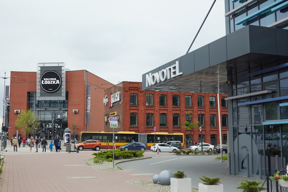 a city street with cars and people walking around