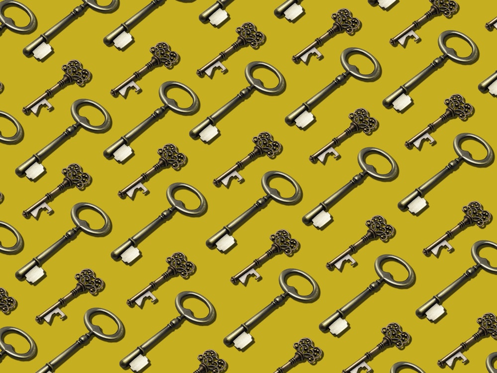 a bunch of keys that are on a yellow background