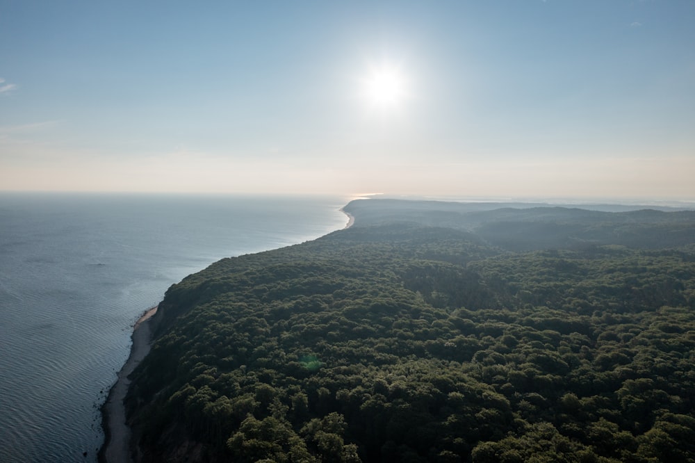 an aerial view of the ocean and land