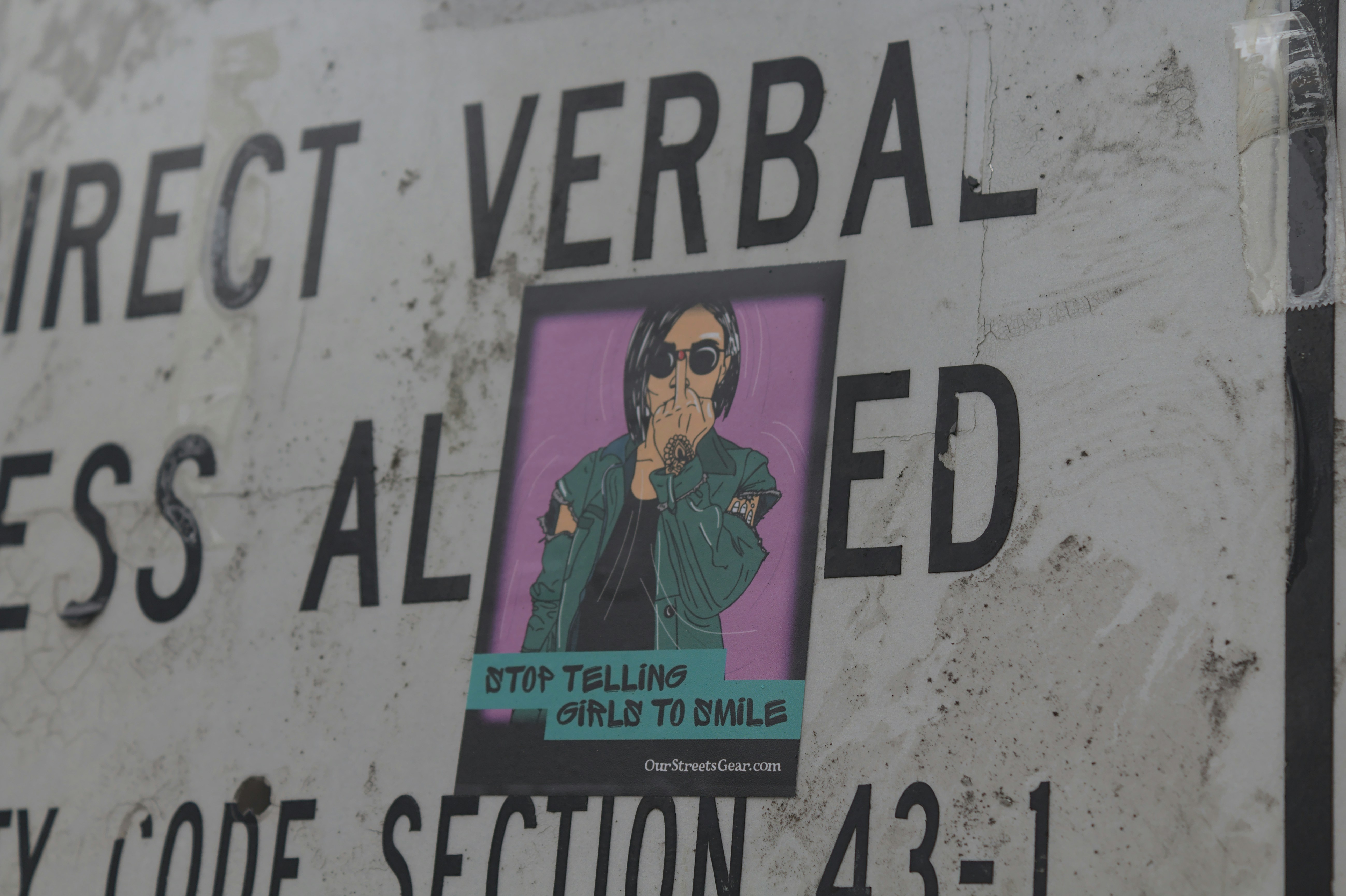 a street sign with a picture of a person on it