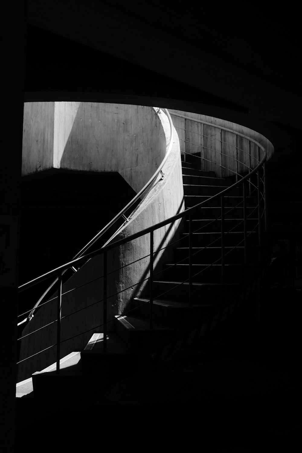 a black and white photo of a staircase