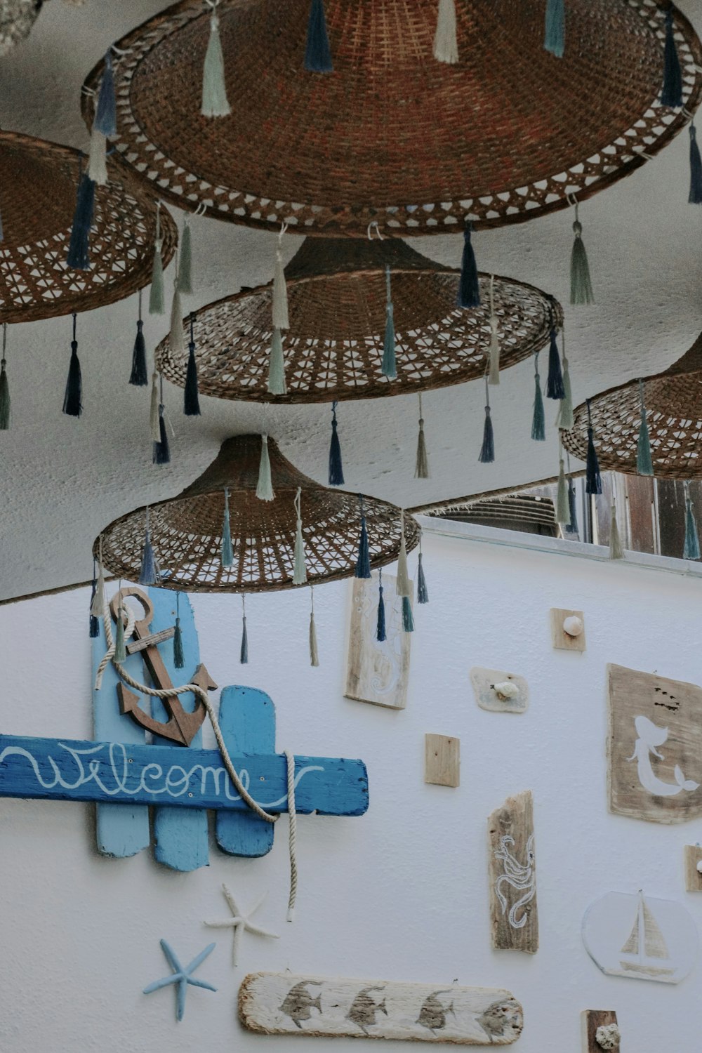 a group of umbrellas hanging from the side of a building