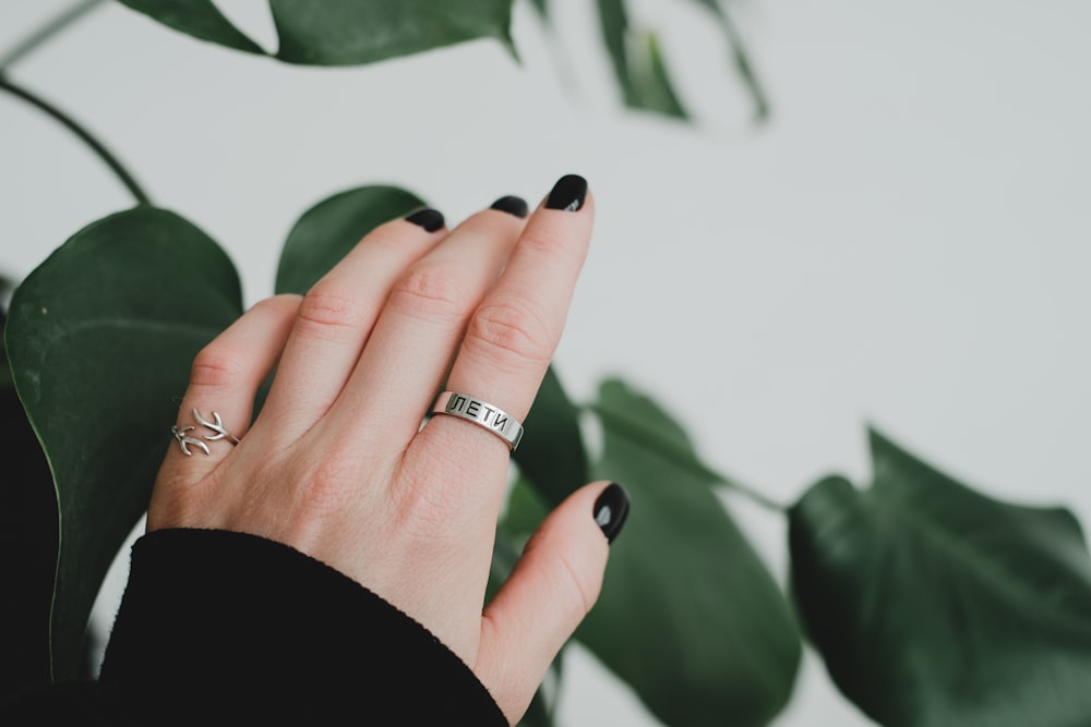 a woman's hand with a ring on it