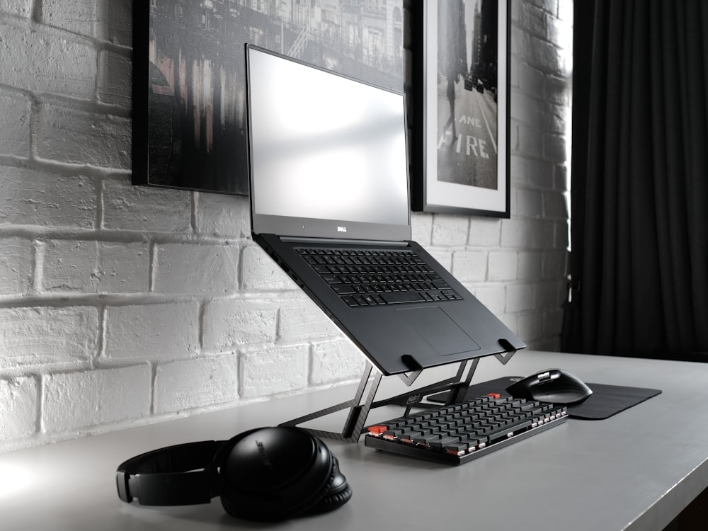 black flat screen computer monitor and black computer keyboard
