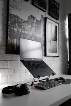 black laptop computer on table