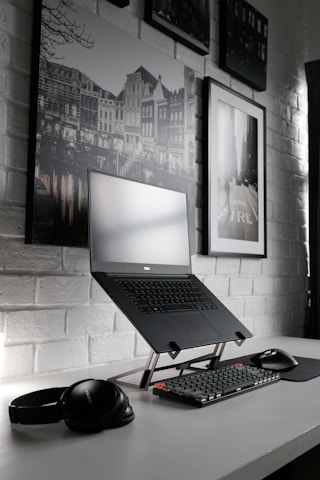 black laptop computer on table