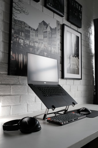 black laptop computer on table