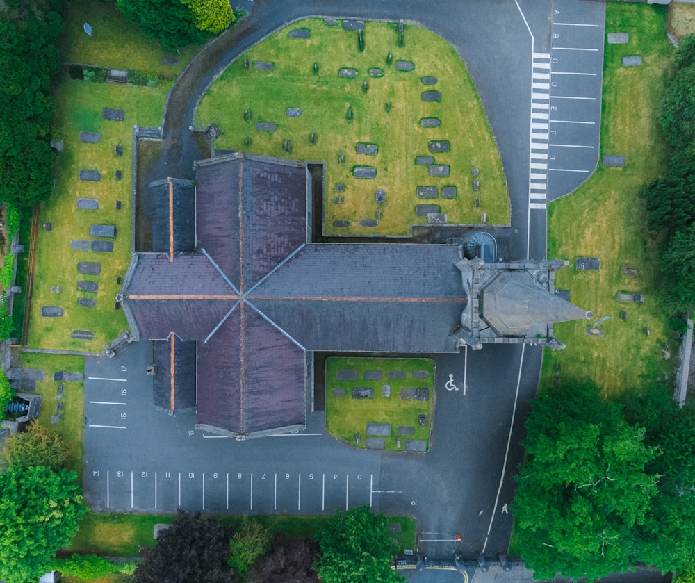 an aerial view of a building in the middle of a parking lot