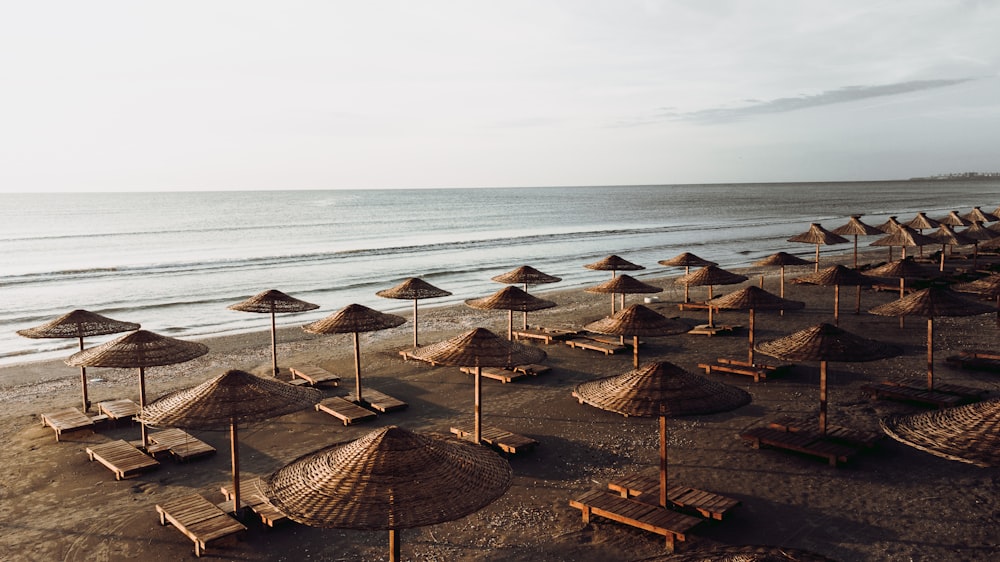 a bunch of umbrellas that are on a beach