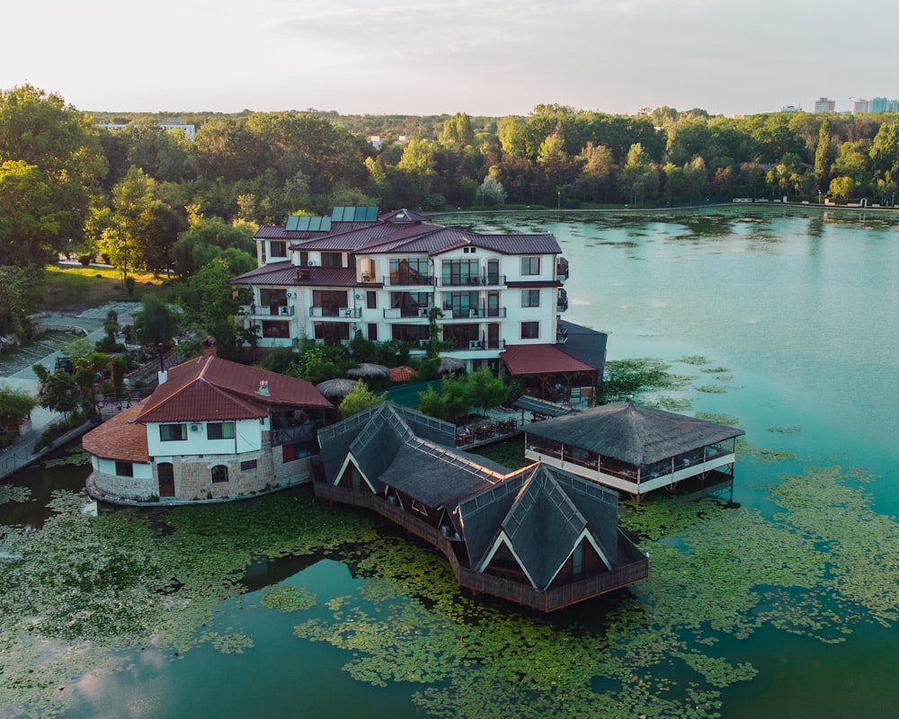 an aerial view of a resort with a lake in the foreground