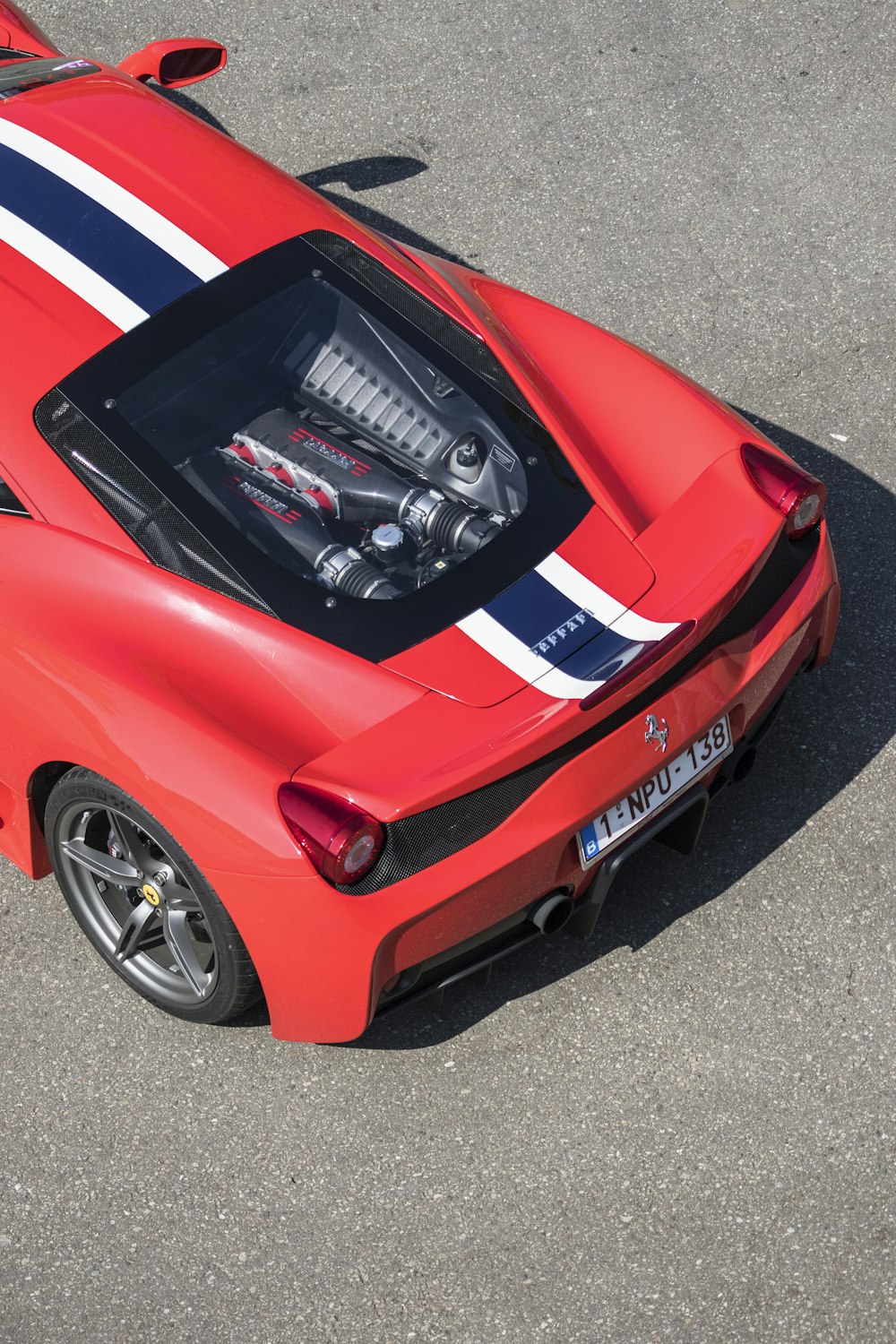 a red sports car parked in a parking lot