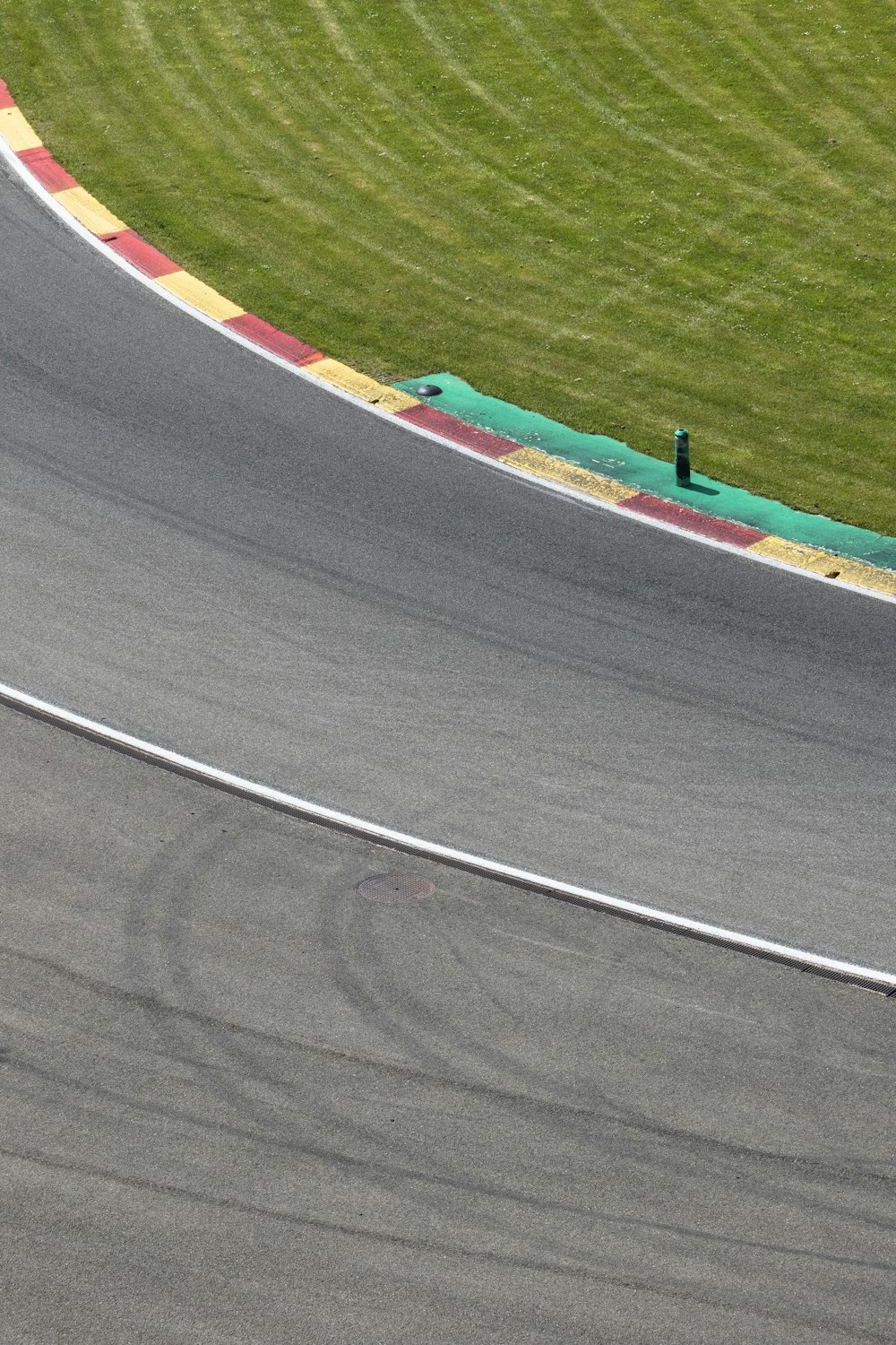 a person riding a motorcycle on a race track