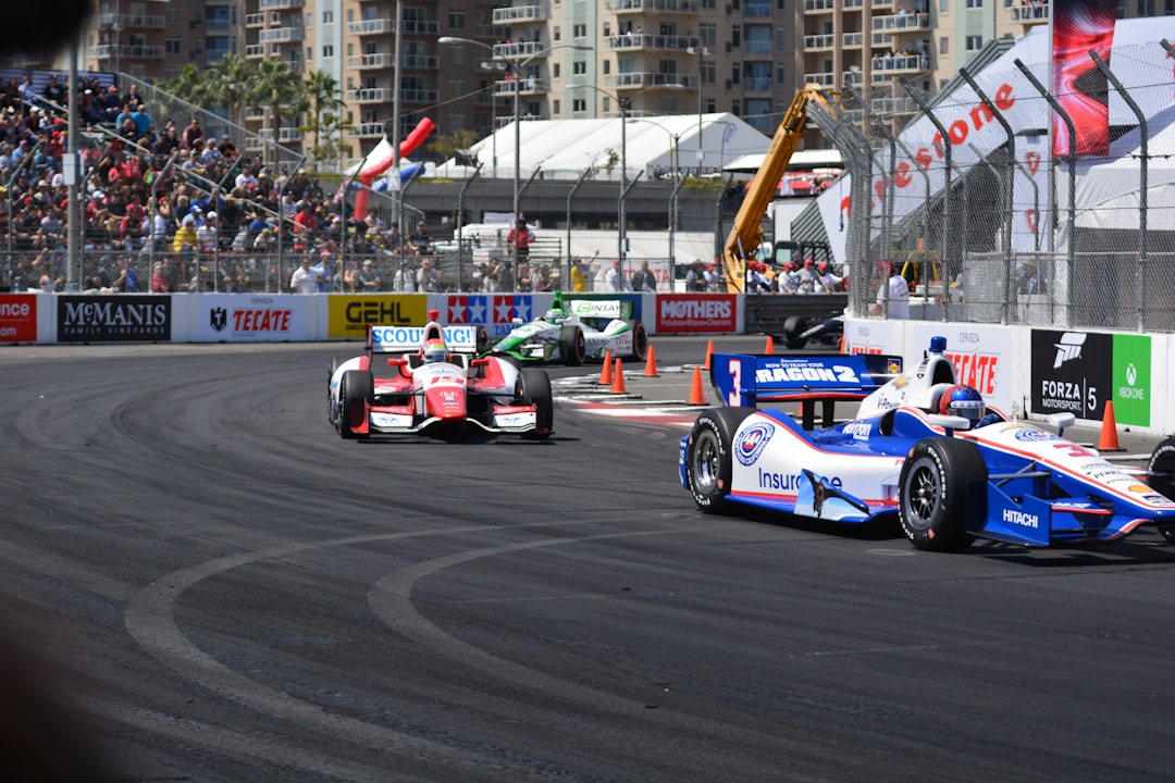 a group of racing cars driving down a race track, Long Beach Grand Prix