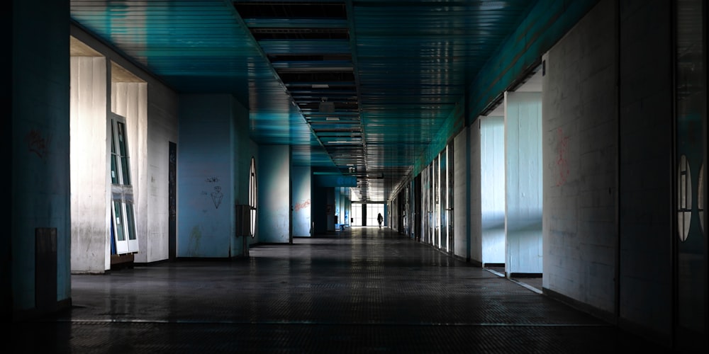 a long hallway with blue and white walls