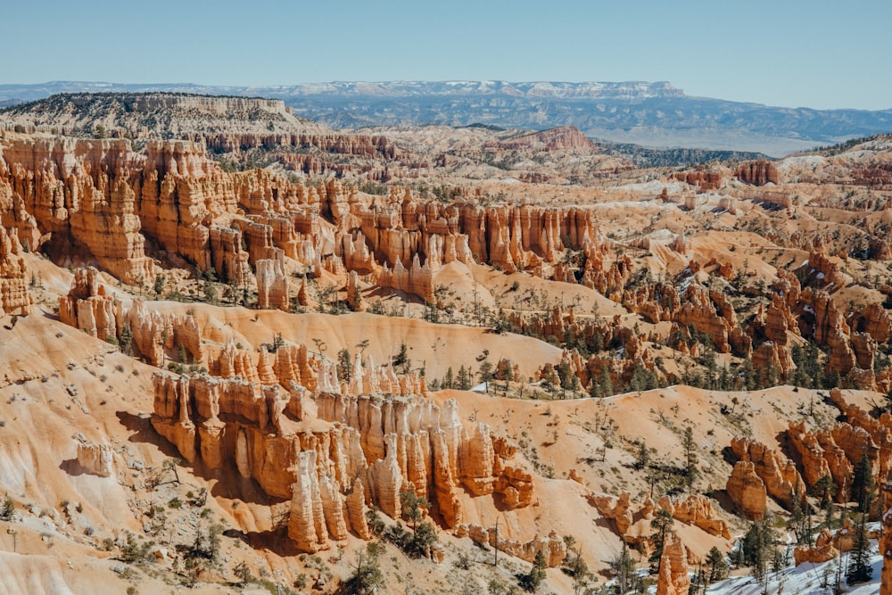 a scenic view of a valley in the mountains