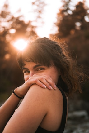 a woman with her hands on her chest