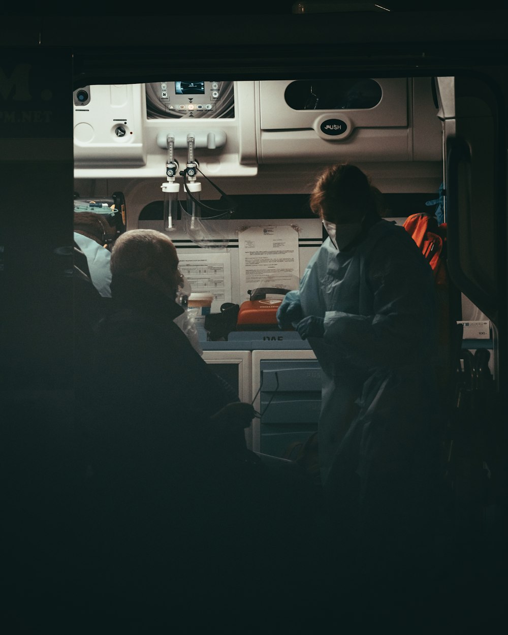 a couple of people sitting next to each other in a room