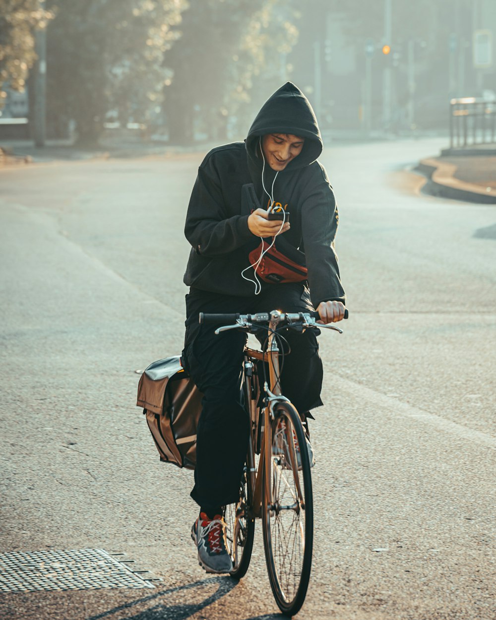 a man riding a bike while listening to music