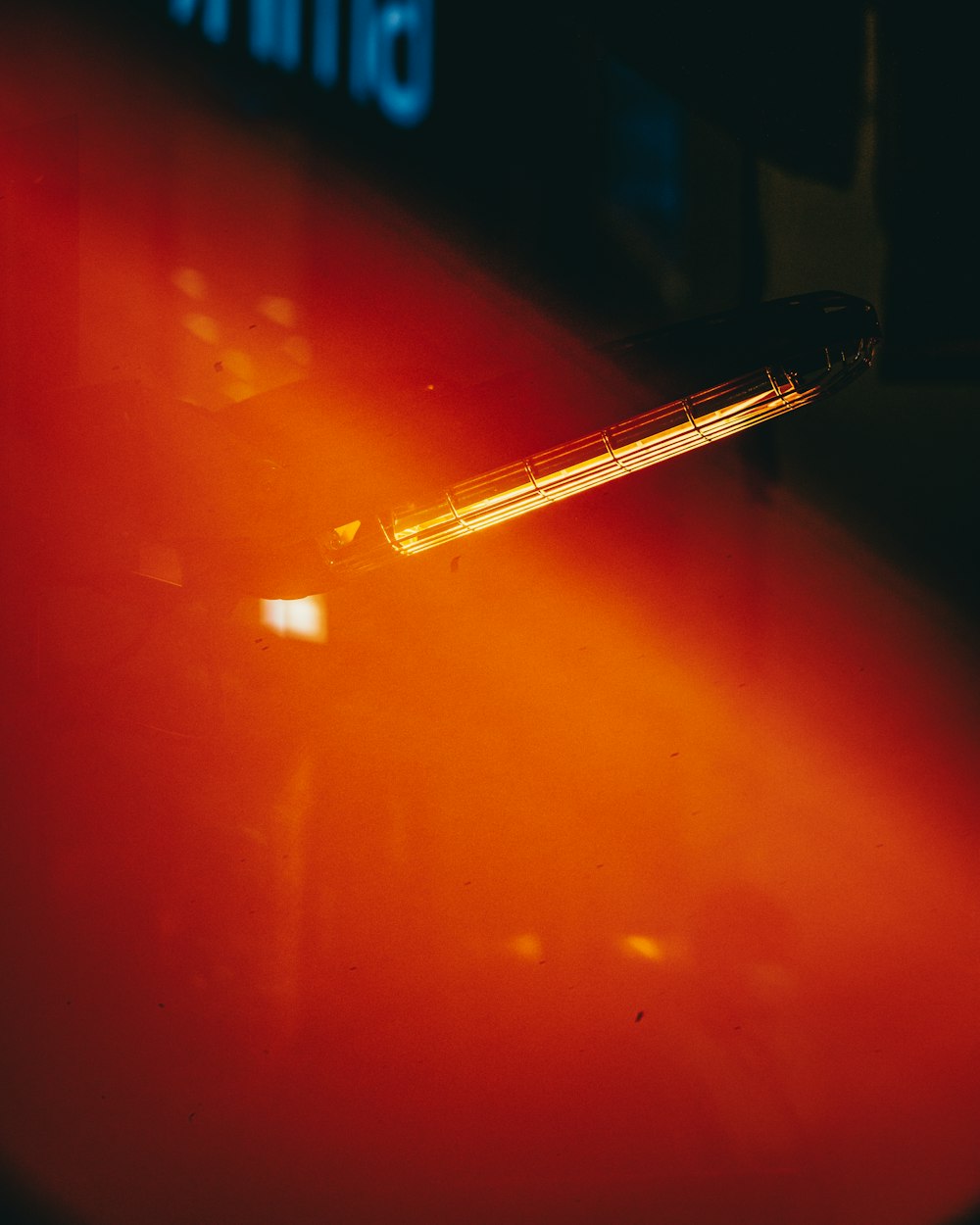 a pen sitting on top of a red surface