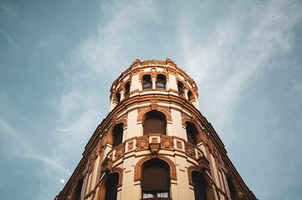 a tall building with a clock on the top of it