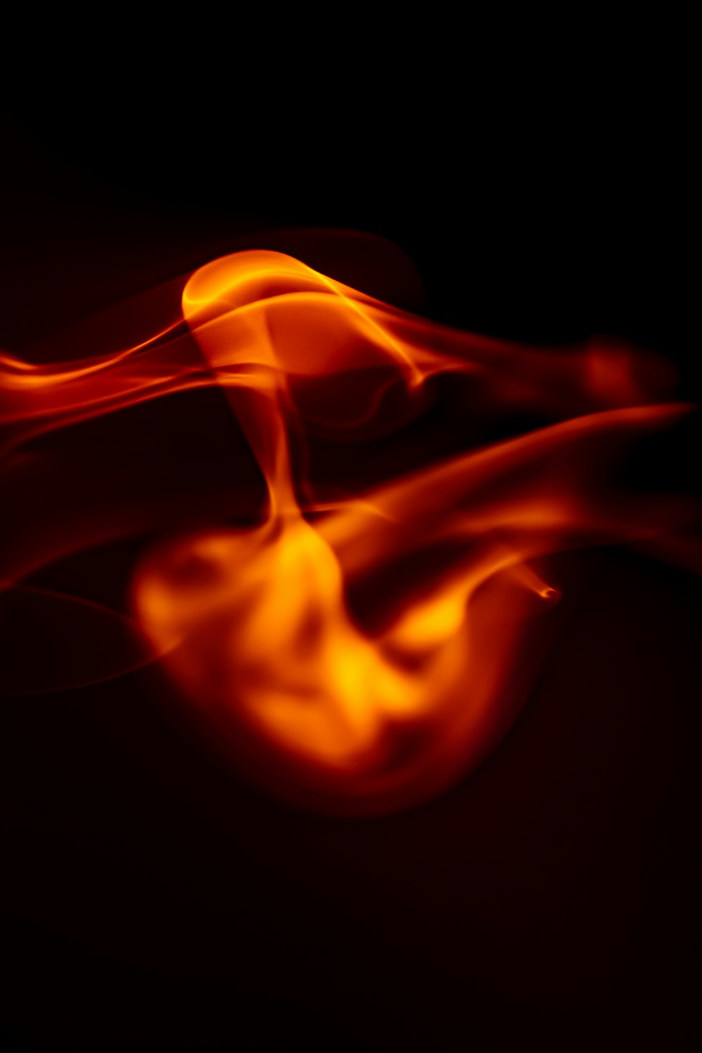 a close up of a fire on a black background