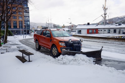 a snow plow is parked on the side of the road