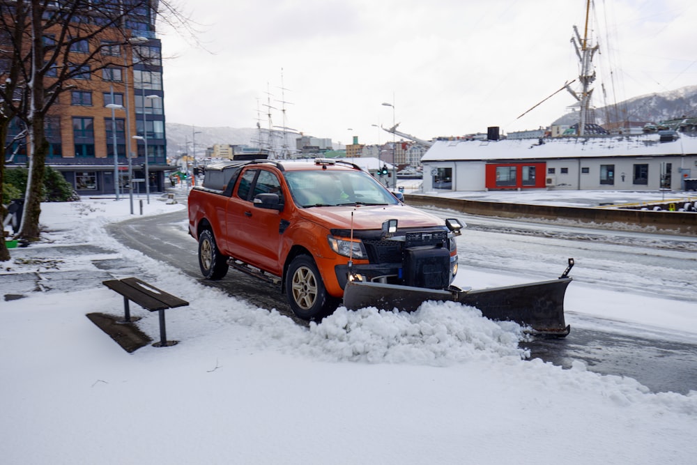 a snow plow is parked on the side of the road