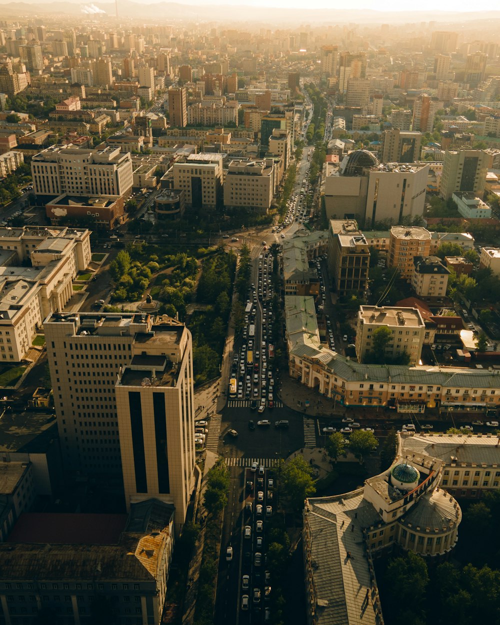 an aerial view of a city with tall buildings