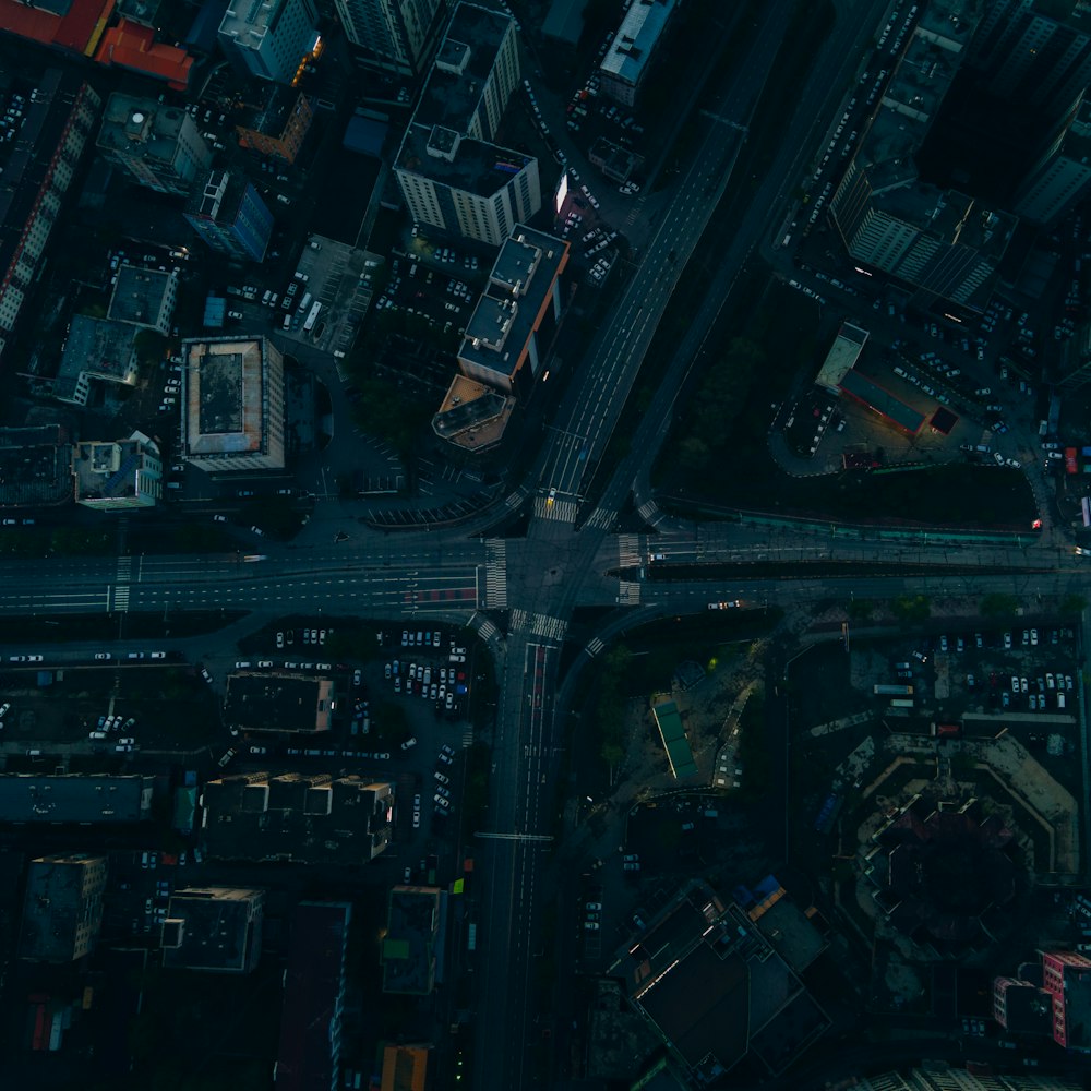 an aerial view of a city intersection at night