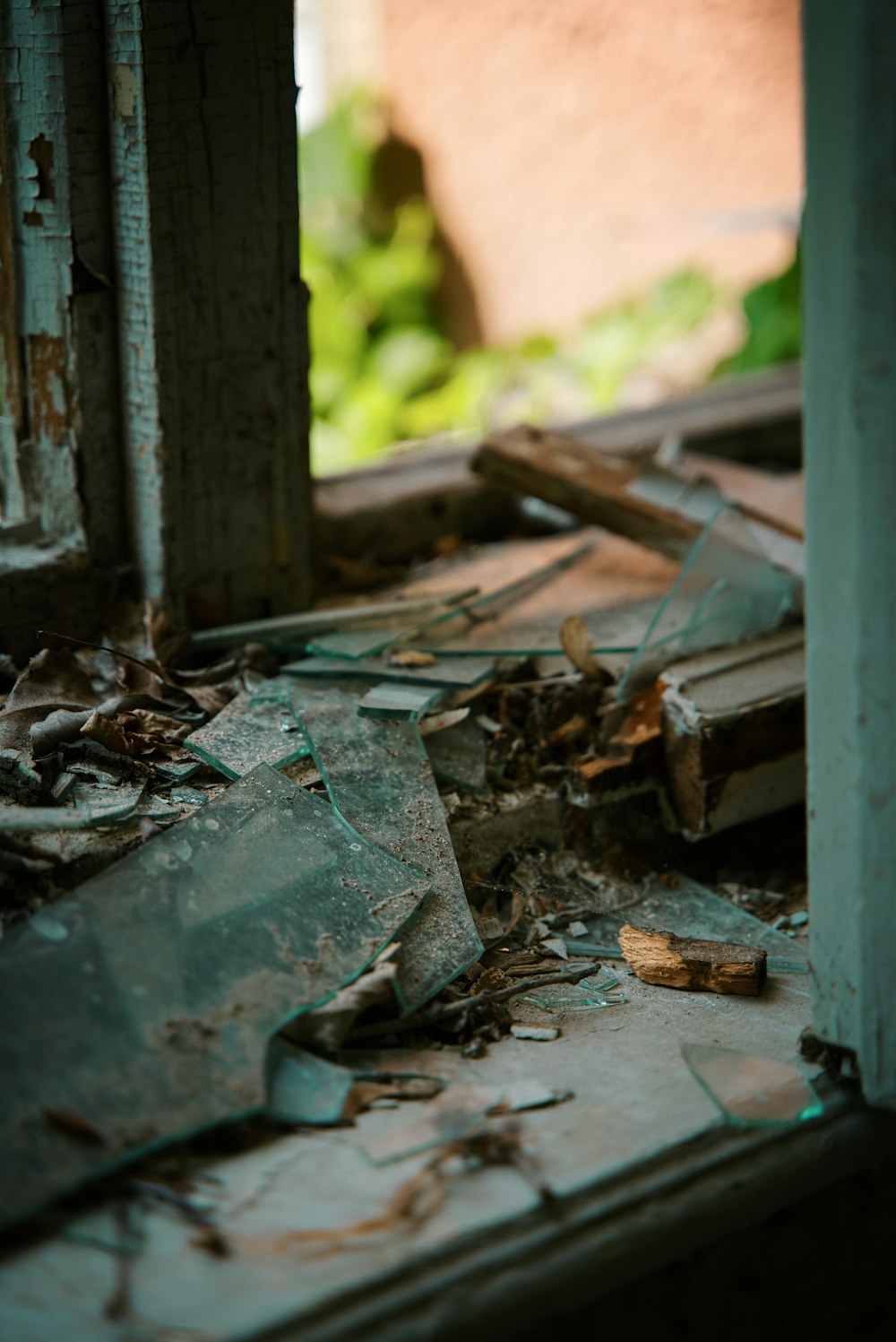 a broken window in a run down building