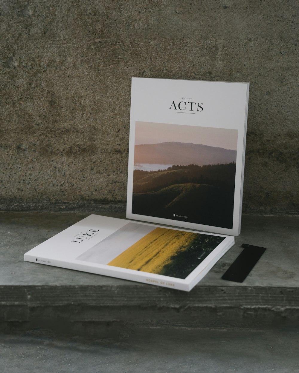 a book sitting on top of a table next to a wall