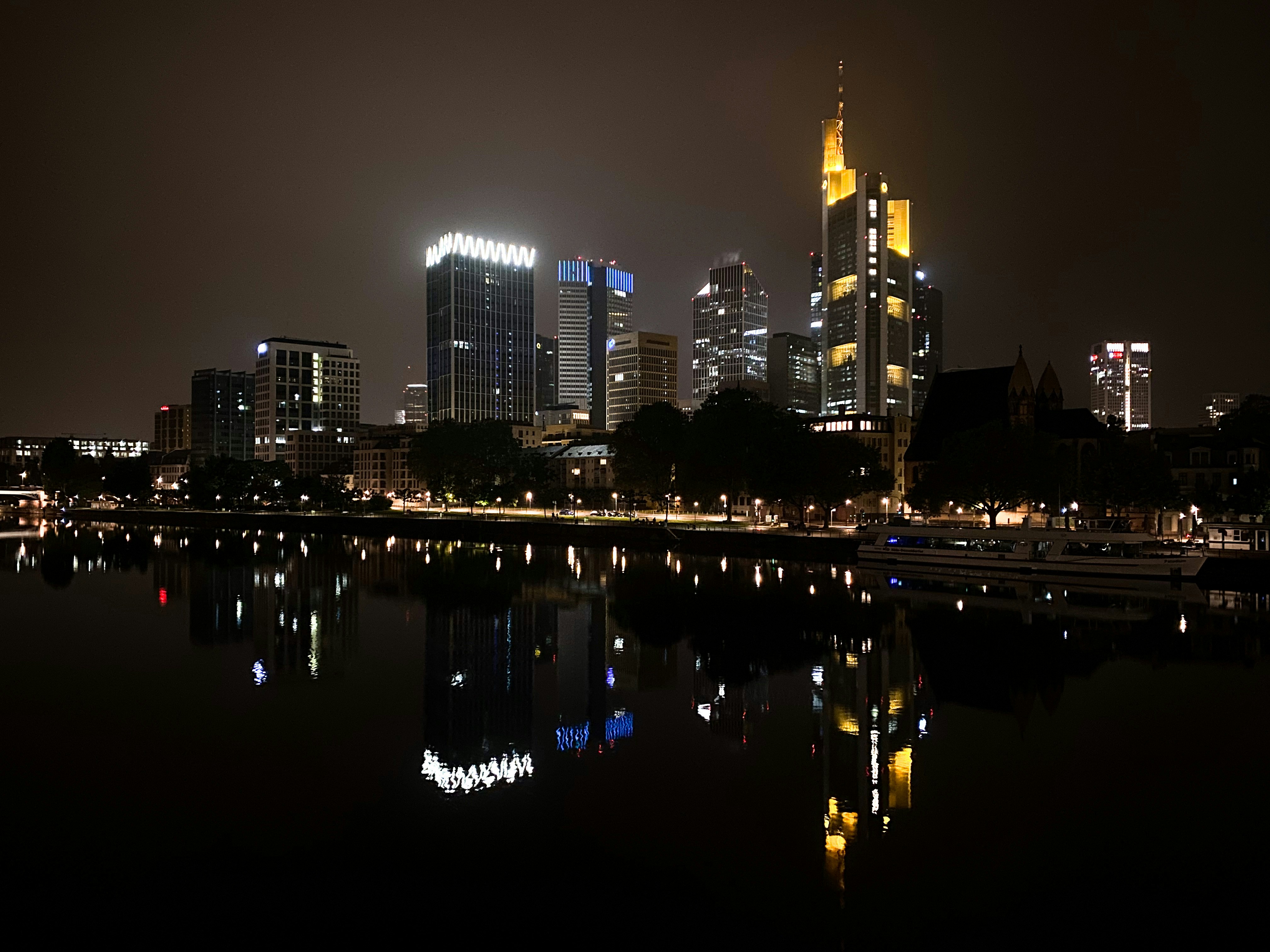 a large body of water with a city in the background