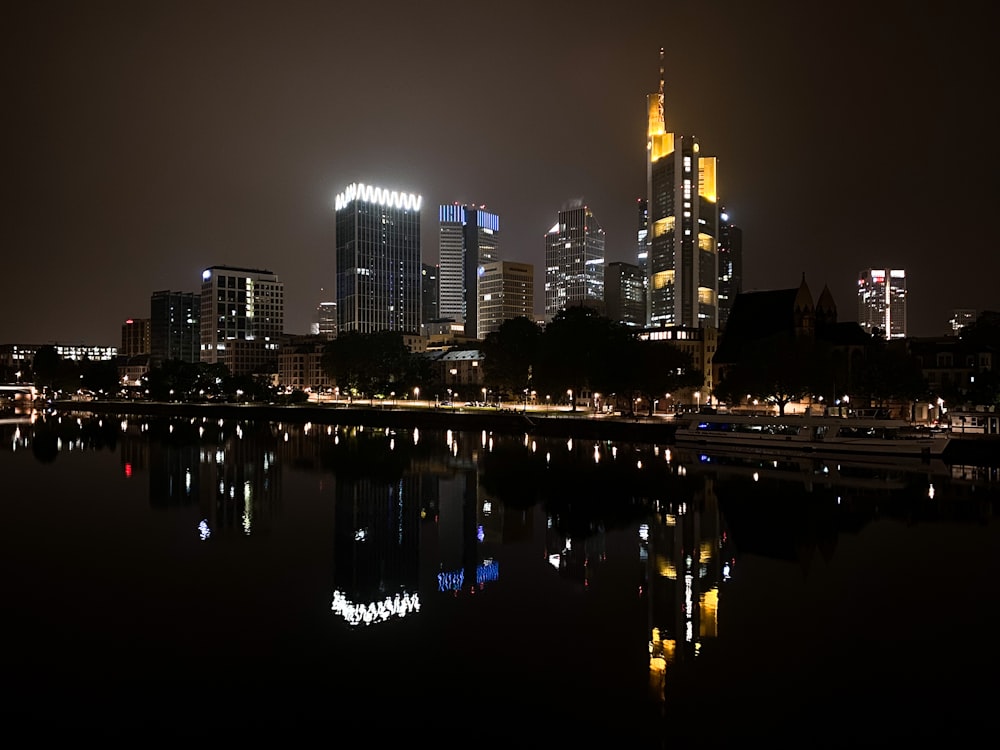 a large body of water with a city in the background