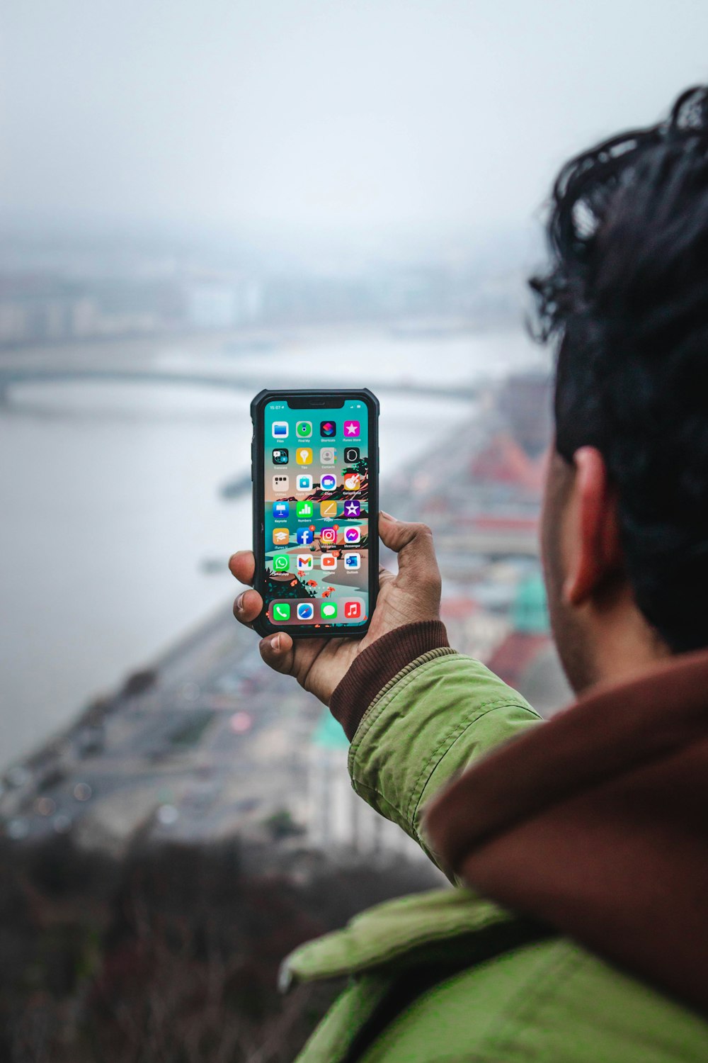 a man holding a cell phone in his hand