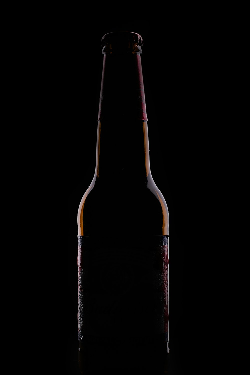 black glass bottle with white background