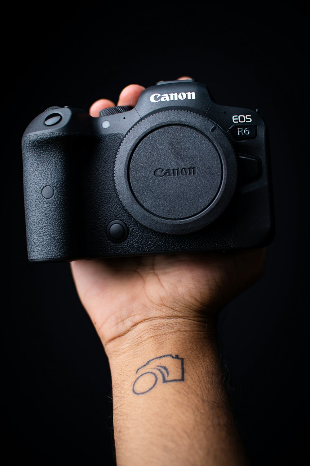 a person holding a camera in their hand