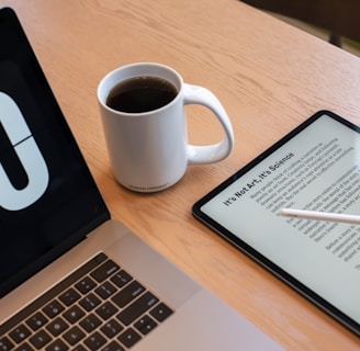 a tablet and a cup of coffee on a table