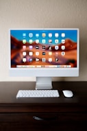 a desktop computer sitting on top of a wooden desk