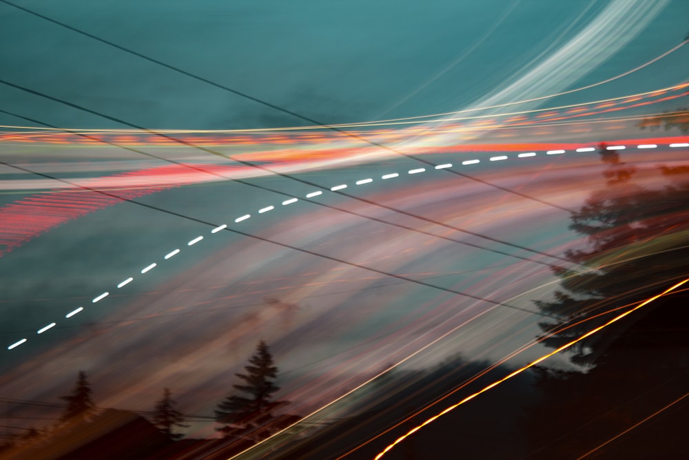 a blurry photo of a street with power lines