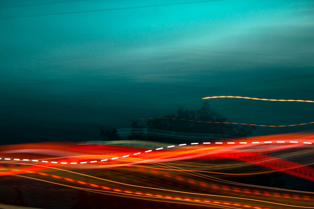 a blurry photo of a city street at night,
