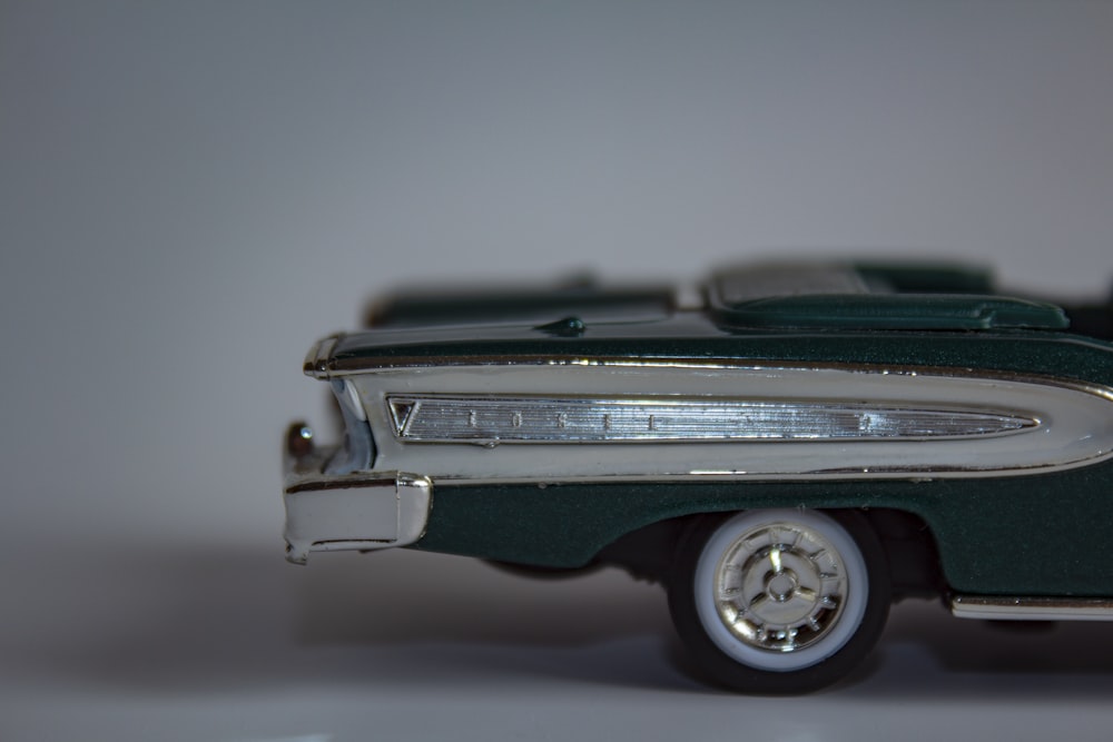a toy model of a green and white car