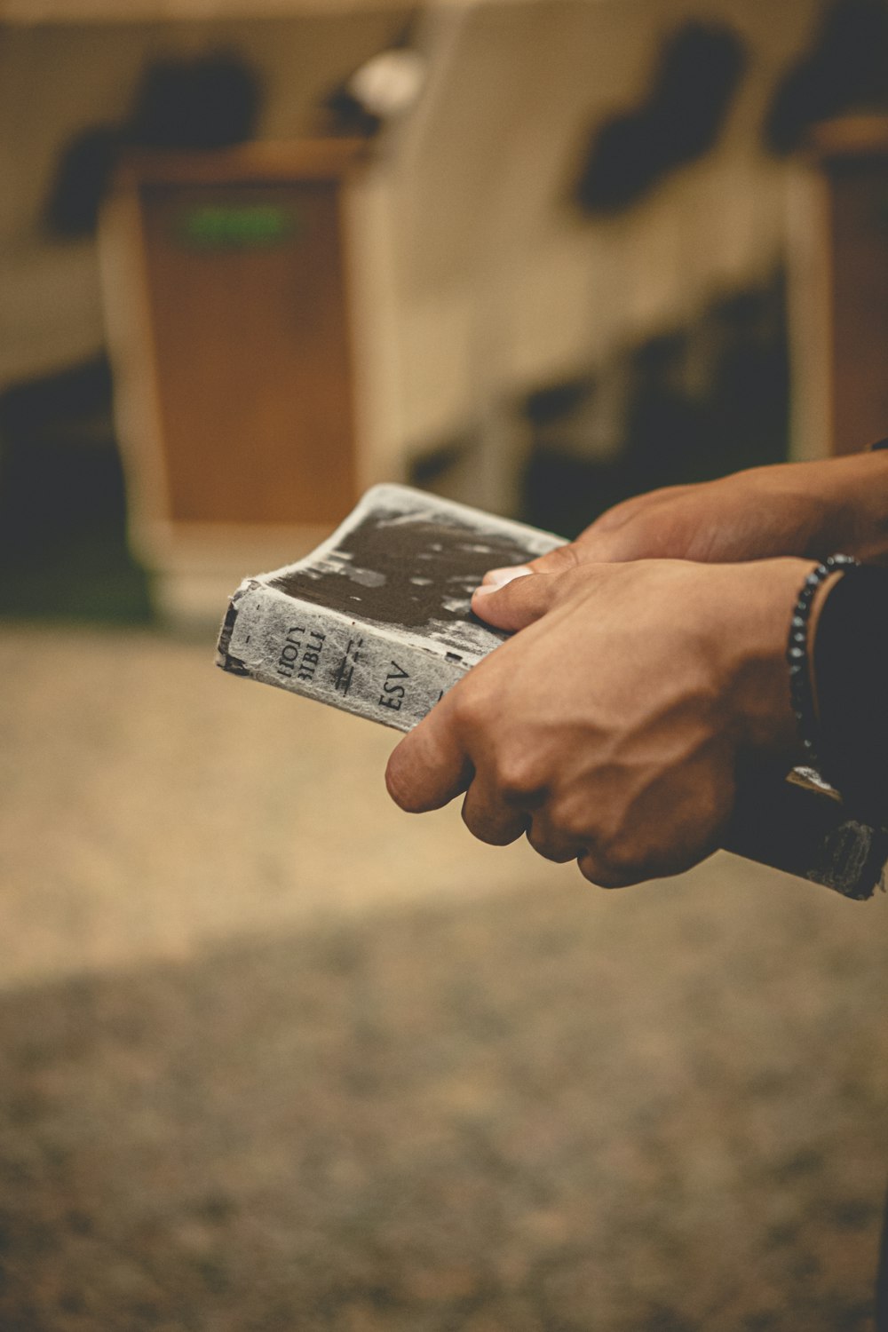 a person holding a cell phone in their hand