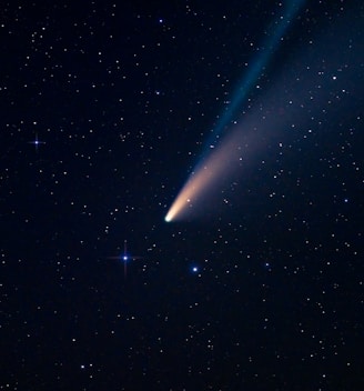 a comet is seen in the night sky