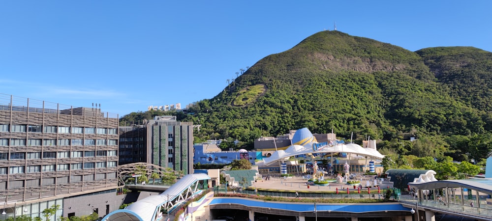 a view of a train station with a mountain in the background