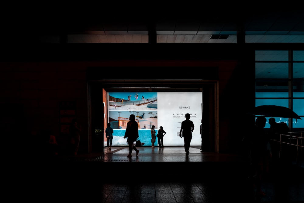 a group of people standing outside of a building