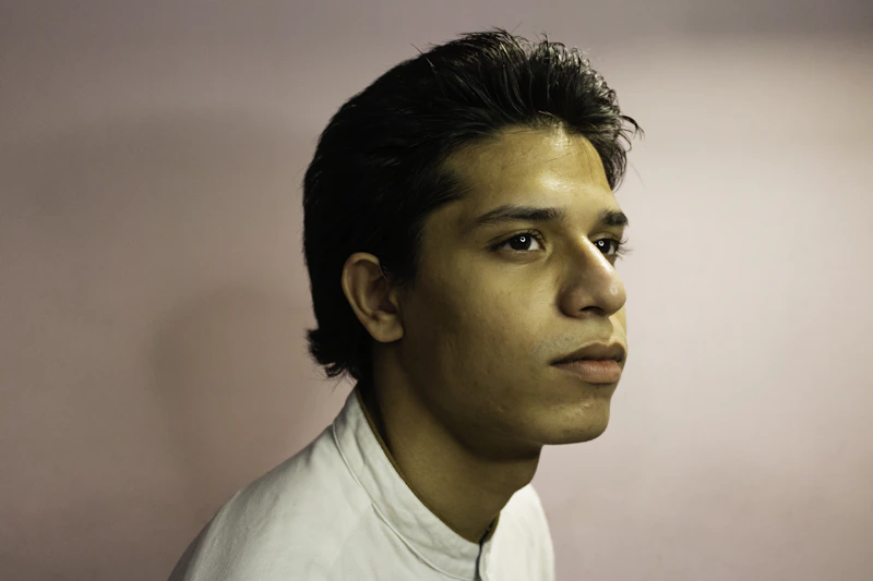 Confident man in white shirt looking aside, India