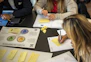 A team brainstorming digital marketing strategies around a table.