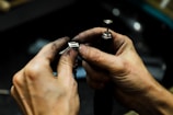 a man is working on a piece of metal